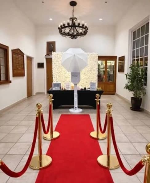 Red carpet, gold stanchions and a photo booth ready for guests